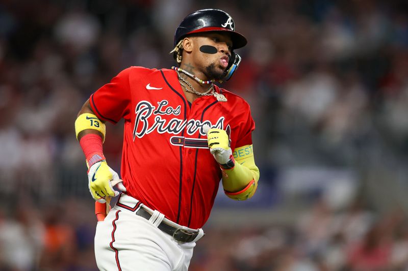 Sep 28, 2023; Atlanta, Georgia, USA; Atlanta Braves right fielder Ronald Acuna Jr. (13) hits a RBI single against the Chicago Cubs in the second inning at Truist Park. Mandatory Credit: Brett Davis-USA TODAY Sports
