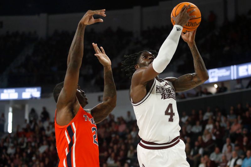 Jan 27, 2024; Starkville, Mississippi, USA; Mississippi State Bulldogs forward Cameron Matthews (4) shoots as Auburn Tigers forward Jaylin Williams (2) defends during the second half at Humphrey Coliseum. Mandatory Credit: Petre Thomas-USA TODAY Sports