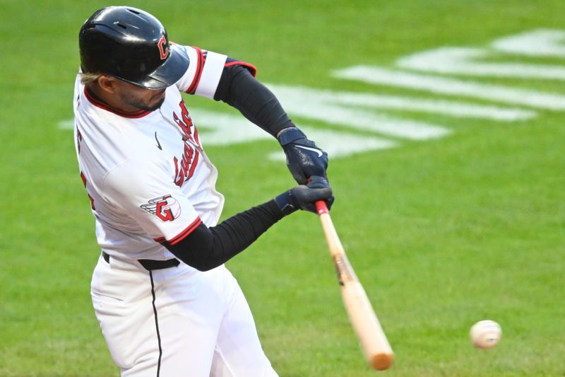 Apr 12, 2025; Cleveland, Ohio, USA; Cleveland Guardians second baseman Gabriel Arias (13) hits an RBI single in the fourth inning against the Kansas City Royals at Progressive Field. Mandatory Credit: David Richard-Imagn Images
