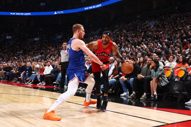 TORONTO, CANADA - MARCH 27: Bruce Brown #11 of the Toronto Raptors dribbles the ball during the game against the New York Knicks on March 27, 2024 at the Scotiabank Arena in Toronto, Ontario, Canada.  NOTE TO USER: User expressly acknowledges and agrees that, by downloading and or using this Photograph, user is consenting to the terms and conditions of the Getty Images License Agreement.  Mandatory Copyright Notice: Copyright 2024 NBAE (Photo by Vaughn Ridley/NBAE via Getty Images)