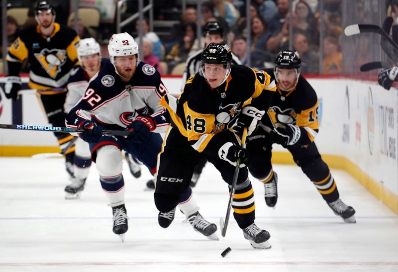 Mar 5, 2024; Pittsburgh, Pennsylvania, USA; Pittsburgh Penguins right wing Valtteri Puustinen (48) skates with the puck against the Columbus Blue Jackets during the third period at PPG Paints Arena. The Penguins won 5-3. Mandatory Credit: Charles LeClaire-USA TODAY Sports