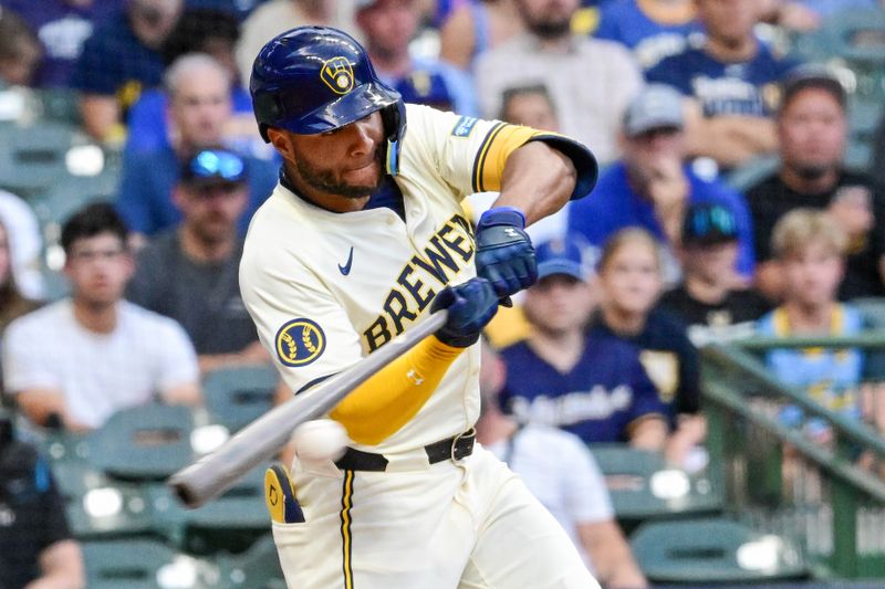 Jun 25, 2024; Milwaukee, Wisconsin, USA; Milwaukee Brewers right fielder Jackson Chourio (11) hits a RBI single against the Texas Rangers in the third inning at American Family Field. Mandatory Credit: Benny Sieu-USA TODAY Sports