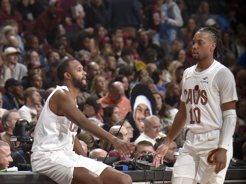 CLEVELAND, OH - NOVEMBER 24: Evan Mobley #4 and Darius Garland #10 of the Cleveland Cavaliers high five during the game against the Toronto Raptors on November 24, 2024 at Rocket Mortgage FieldHouse in Cleveland, Ohio. NOTE TO USER: User expressly acknowledges and agrees that, by downloading and/or using this Photograph, user is consenting to the terms and conditions of the Getty Images License Agreement. Mandatory Copyright Notice: Copyright 2024 NBAE (Photo by David Liam Kyle/NBAE via Getty Images)