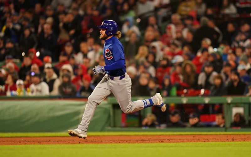 Apr 26, 2024; Boston, Massachusetts, USA; Chicago Cubs right fielder Patrick Wisdom (16) hits a double to drive in two runs against the Boston Red Sox in the seventh inning at Fenway Park. Mandatory Credit: David Butler II-USA TODAY Sports