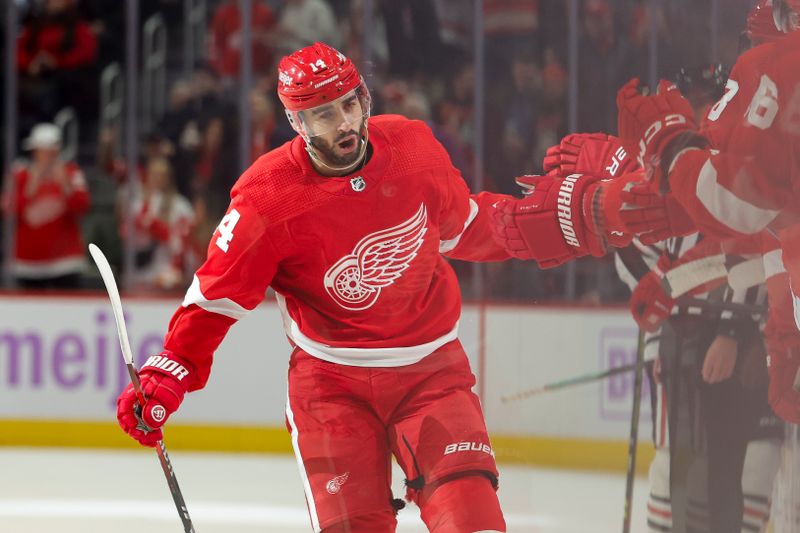 Nov 30, 2023; Detroit, Michigan, USA;  Detroit Red Wings center Robby Fabbri (14) receives congratulations from teammates after scoring in the first period against the Chicago Blackhawks at Little Caesars Arena. Mandatory Credit: Rick Osentoski-USA TODAY Sports