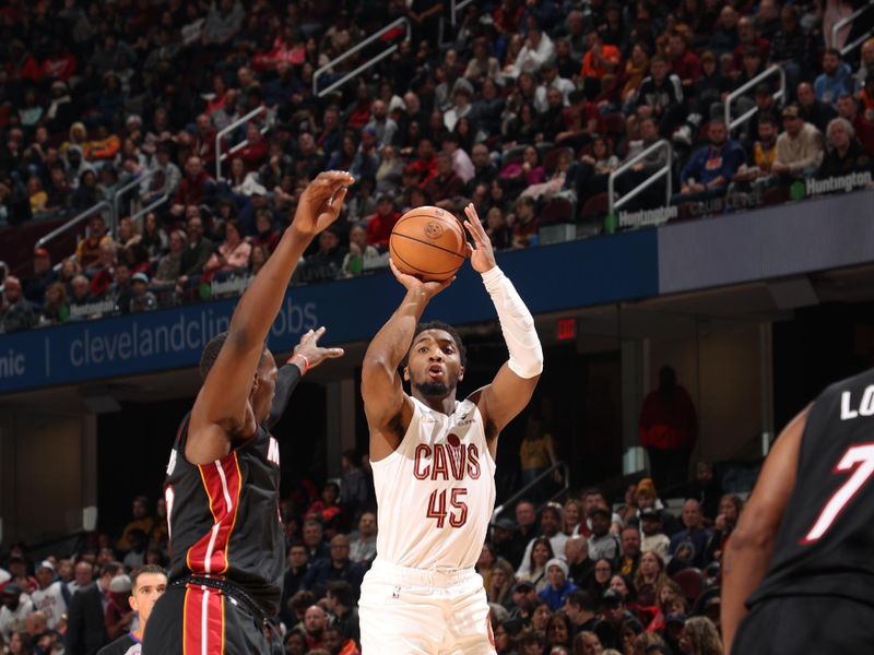 CLEVELAND, OH - NOVEMBER 20: Donovan Mitchell #45 of the Cleveland Cavaliers shoots a three point basket during the game against the Miami Heat on November 20, 2022 at Rocket Mortgage Fieldhouse in Cleveland, Ohio. NOTE TO USER: User expressly acknowledges and agrees that, by downloading and or using this photograph, User is consenting to the terms and conditions of the Getty Images License Agreement. Mandatory Copyright Notice: Copyright 2022 NBAE (Photo by Joe Murphy/NBAE via Getty Images)