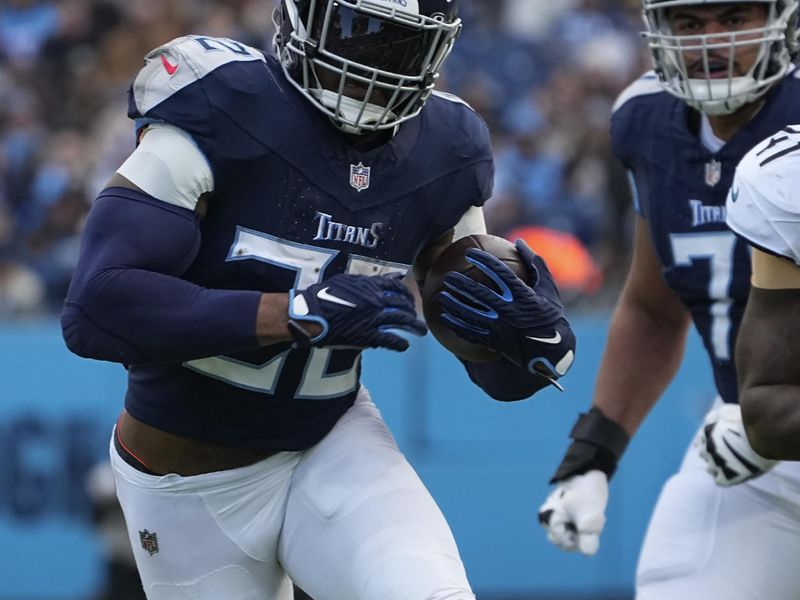 Tennessee Titans running back Derrick Henry (22) runs the ball during the first half of an NFL football game against the Jacksonville Jaguars. Sunday, Jan. 7, 2024, in Nashville, Tenn. (AP Photo/George Walker IV)