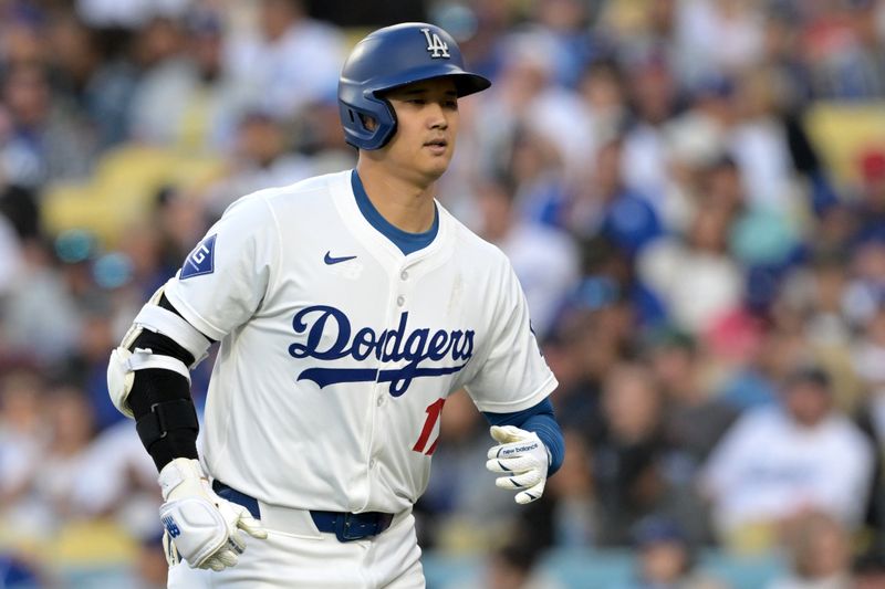 Jun 13, 2024; Los Angeles, California, USA;  Los Angeles Dodgers designated hitter Shohei Ohtani (17) returns to the dugout after a ground out in the first inning against the Texas Rangers at Dodger Stadium. Mandatory Credit: Jayne Kamin-Oncea-USA TODAY Sports