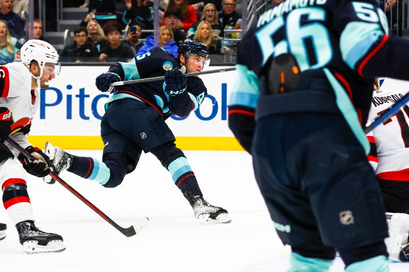 Jan 4, 2024; Seattle, Washington, USA; Seattle Kraken left wing Andre Burakovsky (95) scores a goal against the Ottawa Senators during the second period at Climate Pledge Arena. Mandatory Credit: Joe Nicholson-USA TODAY Sports