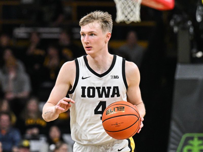 Mar 6, 2025; Iowa City, Iowa, USA; Iowa Hawkeyes guard Josh Dix (4) brings the ball up court against the Michigan State Spartans during the second half at Carver-Hawkeye Arena. Mandatory Credit: Jeffrey Becker-Imagn Images