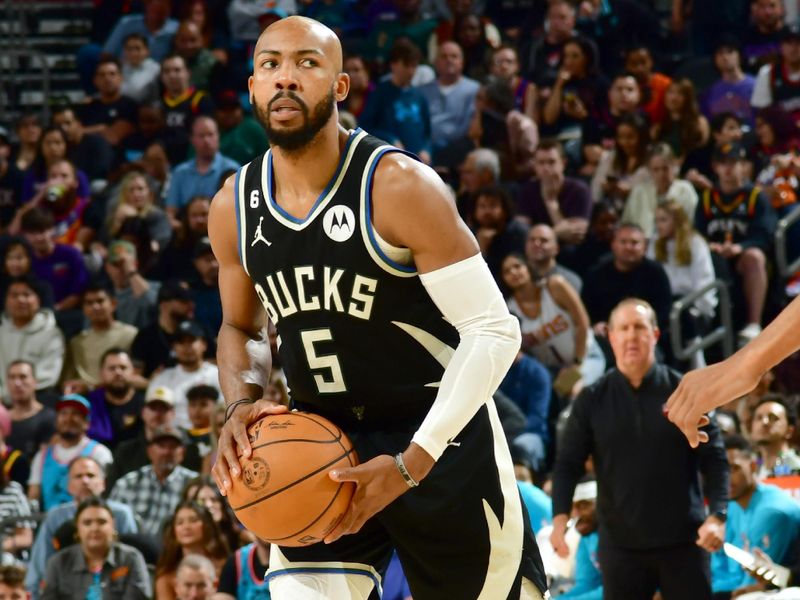 PHOENIX, AZ - MARCH 14: Jevon Carter #5 of the Milwaukee Bucks dribbles the ball during the game against the Phoenix Suns on March 14, 2022 at Footprint Center in Phoenix, Arizona. NOTE TO USER: User expressly acknowledges and agrees that, by downloading and or using this photograph, user is consenting to the terms and conditions of the Getty Images License Agreement. Mandatory Copyright Notice: Copyright 2022 NBAE (Photo by Kate Frese/NBAE via Getty Images)