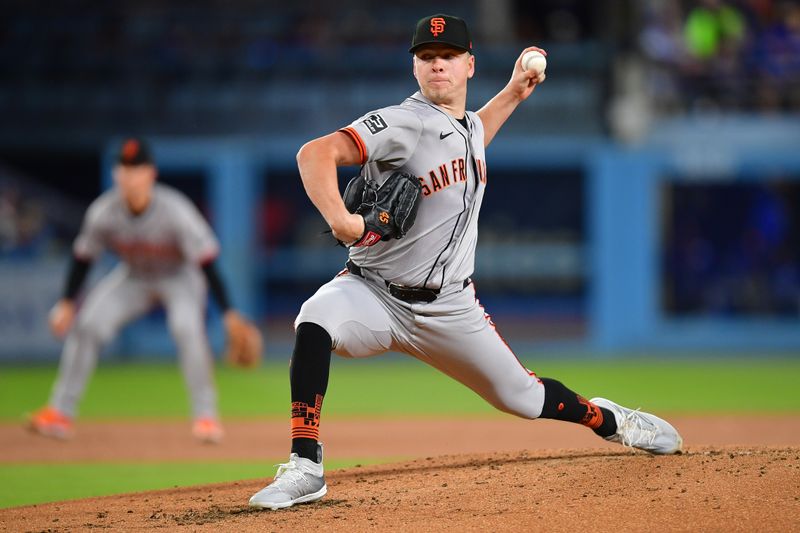 Apr 3, 2024; Los Angeles, California, USA; San Francisco Giants starting pitcher Kyle Harrison (45) throws against the Los Angeles Dodgers during the second inning at Dodger Stadium. Mandatory Credit: Gary A. Vasquez-USA TODAY Sports