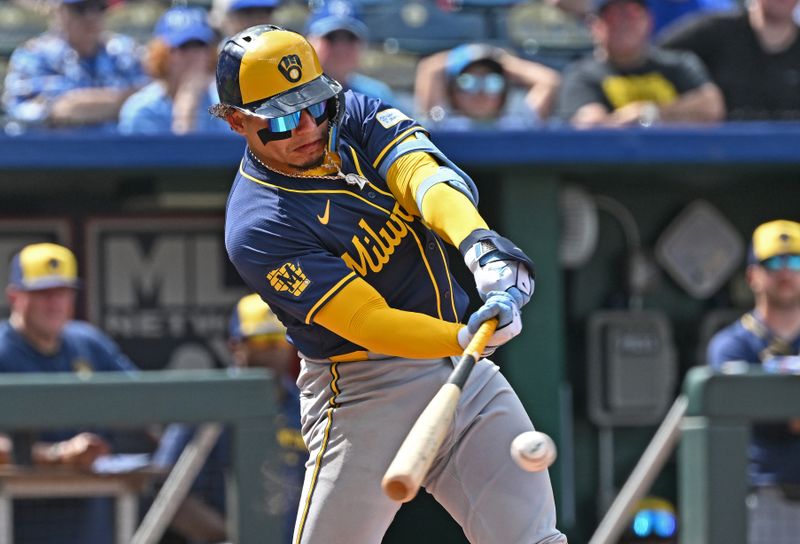 May 8, 2024; Kansas City, Missouri, USA;  Milwaukee Brewers catcher William Contreras (24) drives in a run in the ninth inning against the Kansas City Royals at Kauffman Stadium. Mandatory Credit: Peter Aiken-USA TODAY Sports