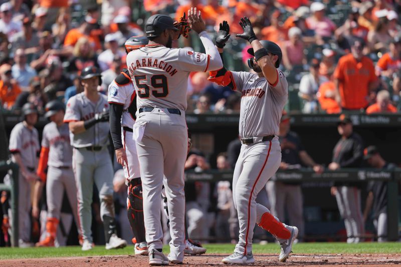 Sep 19, 2024; Baltimore, Maryland, USA; San Francisco Giants outfielder Michael Conforto (8) greeted by designated hitter Jerar Encarnacion (59) following his two run home run in the second inning against the Baltimore Orioles at Oriole Park at Camden Yards. Mandatory Credit: Mitch Stringer-Imagn Images