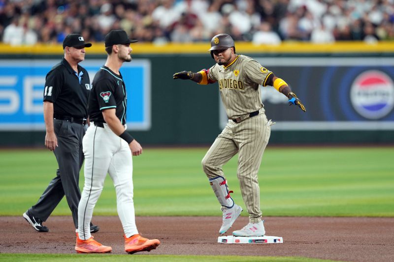 May 4, 2024; Phoenix, Arizona, USA; San Diego Padres designated hitter Luis Arraez (4) reacts after hitting a double against the Arizona Diamondbacks during the first inning at Chase Field. Mandatory Credit: Joe Camporeale-USA TODAY Sports