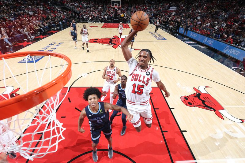 CHICAGO, IL - OCTOBER 12: Julian Phillips #15 of the Chicago Bulls dunks the ball during the game against the Memphis Grizzlies during a NBA preseason game on October 12, 2024 at United Center in Chicago, Illinois. NOTE TO USER: User expressly acknowledges and agrees that, by downloading and or using this photograph, User is consenting to the terms and conditions of the Getty Images License Agreement. Mandatory Copyright Notice: Copyright 2024 NBAE (Photo by Jeff Haynes/NBAE via Getty Images)