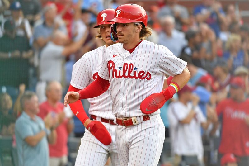 Jul 26, 2023; Philadelphia, Pennsylvania, USA; Philadelphia Phillies second baseman Bryson Stott (5) and first baseman Alec Bohm (28) celebrate after scoring during the fourth inning against the Baltimore Orioles at Citizens Bank Park. Mandatory Credit: Eric Hartline-USA TODAY Sports