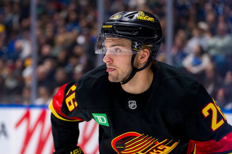 Oct 28, 2024; Vancouver, British Columbia, CAN; Carolina Hurricanes defenseman Sean Walker (26) during a stop in play against the Carolina Hurricanes during the second period at Rogers Arena. Mandatory Credit: Bob Frid-Imagn Images