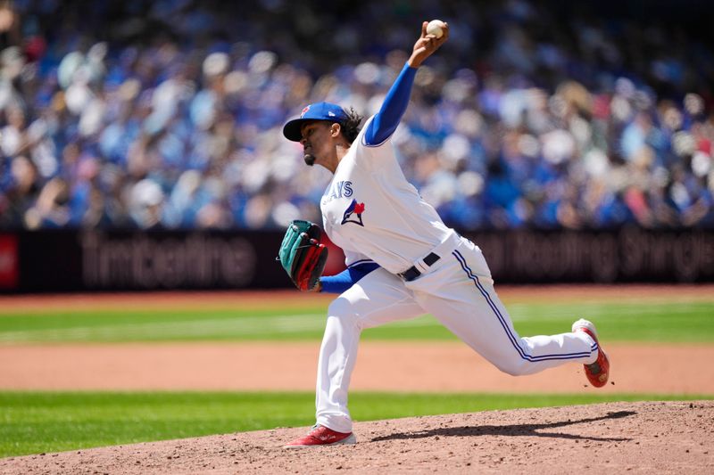 Jul 30, 2023; Toronto, Ontario, CAN; Toronto Blue Jays pitcher Jay Jackson (35) pitches to the Los Angeles Angels during the eighth inning at Rogers Centre. Mandatory Credit: John E. Sokolowski-USA TODAY Sports