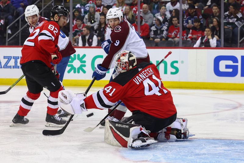 Feb 6, 2024; Newark, New Jersey, USA; Colorado Avalanche left wing Zach Parise (9) tips the puck wide of New Jersey Devils goaltender Vitek Vanecek (41) during the first period at Prudential Center. Mandatory Credit: Ed Mulholland-USA TODAY Sports