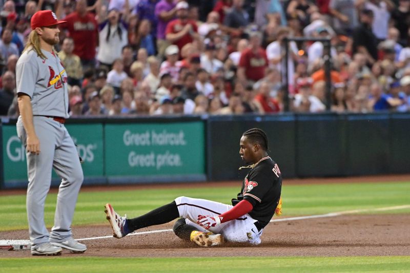 Jul 26, 2023; Phoenix, Arizona, USA;  Arizona Diamondbacks shortstop Geraldo Perdomo (2) hits a triple as St. Louis Cardinals second baseman Taylor Motter (55)looks on i the first inning at Chase Field. Mandatory Credit: Matt Kartozian-USA TODAY Sports