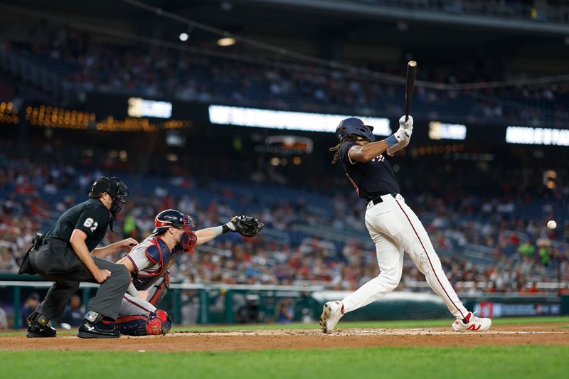 Sep 11, 2024; Washington, District of Columbia, USA; Washington Nationals outfielder James Wood (29) hits an RBI single against the Atlanta Braves during the third inning at Nationals Park. Mandatory Credit: Geoff Burke-Imagn Images