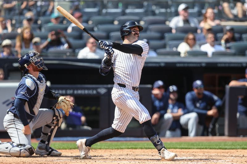 May 3, 2025; Bronx, New York, USA;  New York Yankees catcher Austin Wells (28) hits a solo home run in the fifth inning against the Tampa Bay Rays at Yankee Stadium. Mandatory Credit: Wendell Cruz-Imagn Images