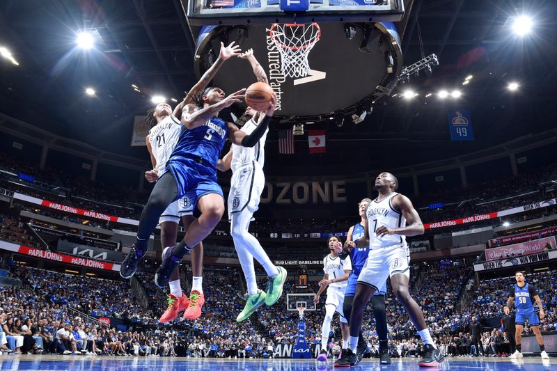 ORLANDO, FL - OCTOBER 25: Paolo Banchero #5 of the Orlando Magic drives to the basket during the game against the Brooklyn Nets on October 25, 2024 at Kia Center in Orlando, Florida. NOTE TO USER: User expressly acknowledges and agrees that, by downloading and or using this photograph, User is consenting to the terms and conditions of the Getty Images License Agreement. Mandatory Copyright Notice: Copyright 2024 NBAE (Photo by Fernando Medina/NBAE via Getty Images)