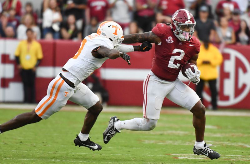 Oct 21, 2023; Tuscaloosa, Alabama, USA;  Alabama Crimson Tide running back Jase McClellan (2) stiff arms Tennessee Volunteers defensive back Brandon Turnage (8) as he attempts to evade a tackle at Bryant-Denny Stadium. Alabama defeated Tennessee 34-20. Mandatory Credit: Gary Cosby Jr.-USA TODAY Sports