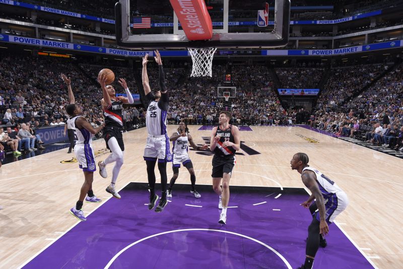 SACRAMENTO, CA - OCTOBER 13: Dalano Banton #5 of the Portland Trail Blazers drives to the basket during the game against the Sacramento Kings during a NBA preseason game on October 13, 2024 at Golden 1 Center in Sacramento, California. NOTE TO USER: User expressly acknowledges and agrees that, by downloading and or using this Photograph, user is consenting to the terms and conditions of the Getty Images License Agreement. Mandatory Copyright Notice: Copyright 2024 NBAE (Photo by Rocky Widner/NBAE via Getty Images)