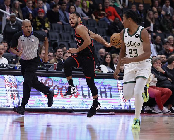 TORONTO, ON- NOVEMBER 15  - Toronto Raptors guard Markquis Nowell (24) makes a behind the back pass around Milwaukee Bucks guard TyTy Washington Jr. (23) late in the game as the Toronto Raptors fall to the Milwaukee Bucks 128-112 at Scotiabank Arena in Toronto. November 15, 2023.        (Steve Russell/Toronto Star via Getty Images)