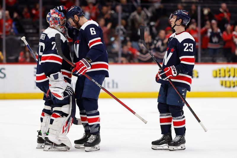 Feb 20, 2024; Washington, District of Columbia, USA; Washington Capitals goaltender Charlie Lindgren (79) celebrates with Capitals defenseman Joel Edmundson (6) after their game against the New Jersey Devils at Capital One Arena. Mandatory Credit: Geoff Burke-USA TODAY Sports