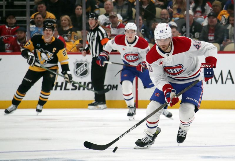 Nov 2, 2024; Pittsburgh, Pennsylvania, USA;  Montreal Canadiens right wing Joel Armia (40) moves the puck up ice against the Pittsburgh Penguins during the second period at PPG Paints Arena. Mandatory Credit: Charles LeClaire-Imagn Images