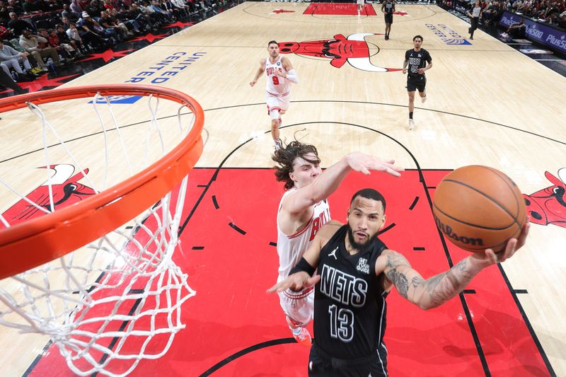 CHICAGO, IL - DECEMBER 2: Tyrese Martin #13 of the Brooklyn Nets drives to the basket during the game against the Chicago Bulls on December 2, 2024 at United Center in Chicago, Illinois. NOTE TO USER: User expressly acknowledges and agrees that, by downloading and or using this photograph, User is consenting to the terms and conditions of the Getty Images License Agreement. Mandatory Copyright Notice: Copyright 2024 NBAE (Photo by Jeff Haynes/NBAE via Getty Images)