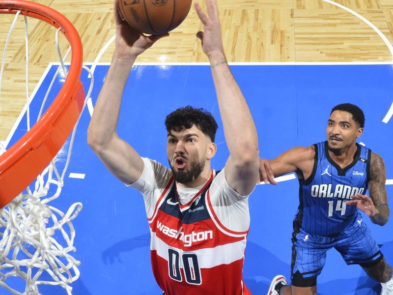 ORLANDO, FL - FEBRUARY 23:  Tristan Vukcevic #00 of the Washington Wizards drives to the basket during the game against the Orlando Magic on February 23, 2025 at Kia Center in Orlando, Florida. NOTE TO USER: User expressly acknowledges and agrees that, by downloading and or using this photograph, User is consenting to the terms and conditions of the Getty Images License Agreement. Mandatory Copyright Notice: Copyright 2025 NBAE (Photo by Fernando Medina/NBAE via Getty Images)