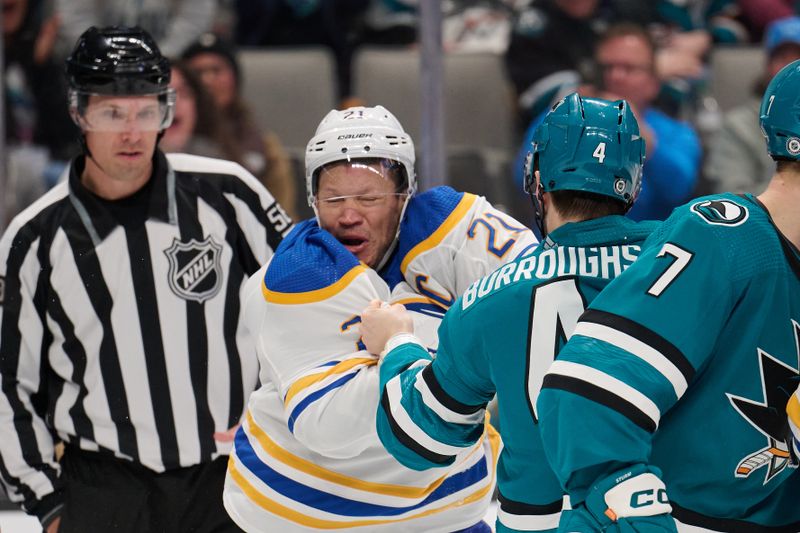 Jan 27, 2024; San Jose, California, USA; Buffalo Sabres right wing Kyle Okposo (21) fights against San Jose Sharks defenseman Kyle Burroughs (4) during the third period at SAP Center at San Jose. Mandatory Credit: Robert Edwards-USA TODAY Sports