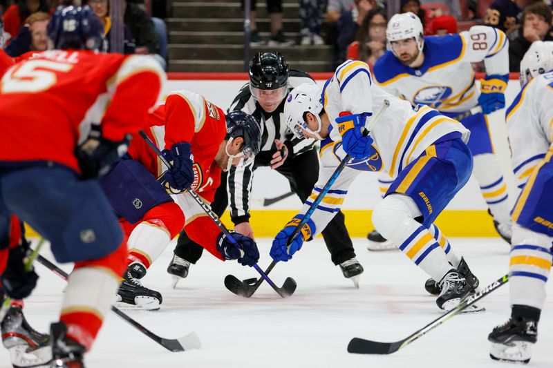 Apr 4, 2023; Sunrise, Florida, USA; Florida Panthers center Aleksander Barkov (16) and Buffalo Sabres right wing Jack Quinn (22) face-off during the first period at FLA Live Arena. Mandatory Credit: Sam Navarro-USA TODAY Sports