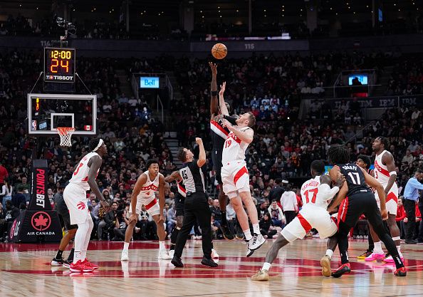 TORONTO, ON - OCTOBER 30: Jakob Poeltl #19 of the Toronto Raptors tips off the game against Deandre Ayton #2 of the Portland Trail Blazers during the first half of their basketball game at the Scotiabank Arena on October 30, 2023 in Toronto, Ontario, Canada. NOTE TO USER: User expressly acknowledges and agrees that, by downloading and/or using this Photograph, user is consenting to the terms and conditions of the Getty Images License Agreement. (Photo by Mark Blinch/Getty Images)