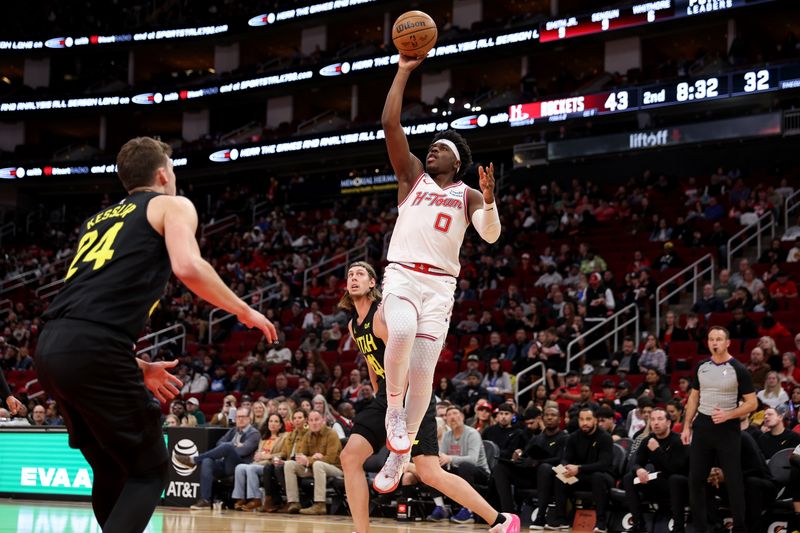 HOUSTON, TEXAS - JANUARY 20: Aaron Holiday #0 of the Houston Rockets shoots the ball in the first half against the Utah Jazz at Toyota Center on January 20, 2024 in Houston, Texas.  NOTE TO USER: User expressly acknowledges and agrees that, by downloading and or using this photograph, User is consenting to the terms and conditions of the Getty Images License Agreement. (Photo by Tim Warner/Getty Images)