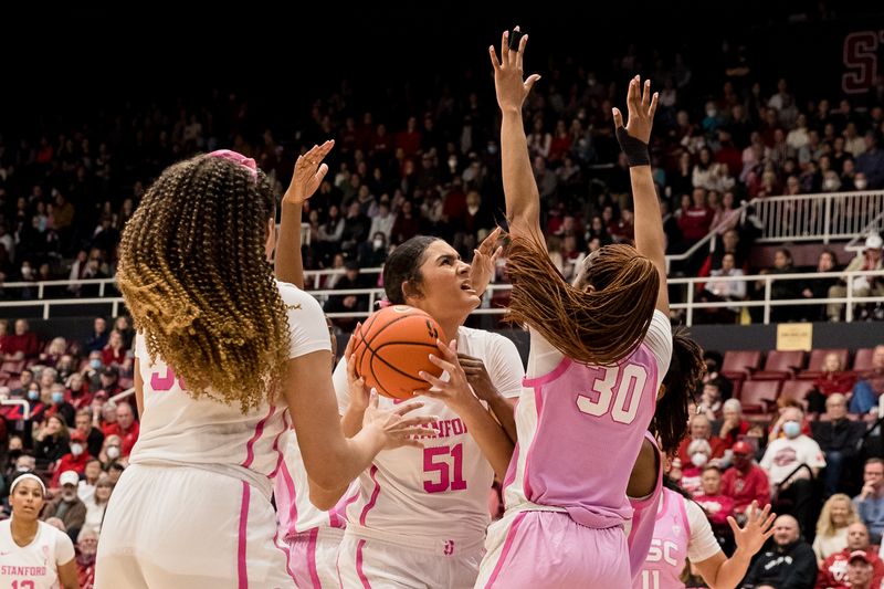 Feb 17, 2023; Stanford, California, USA;  USC Trojans forward Kadi Sissoko (30) defends Stanford Cardinal center Lauren Betts (51) during the first half at Maples Pavilion. Mandatory Credit: John Hefti-USA TODAY Sports