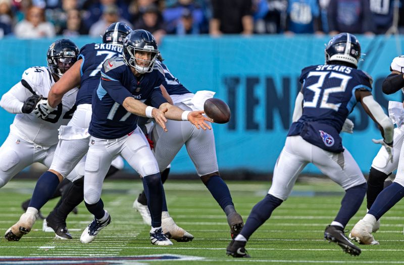 Tennessee Titans quarterback Ryan Tannehill (17) pitches the ball to running back Tyjae Spears (32) during their NFL football game against the Jacksonville Jaguars Sunday, Jan. 7, 2024, in Nashville, Tenn. (AP Photo/Wade Payne)