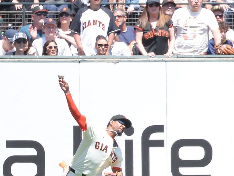 Jun 5, 2025; San Francisco, California, USA; San Francisco Giants left fielder Jerar Encarnacion (59) throws the ball to second base for an out against the San Diego Padres during the seventh inning at Oracle Park. Mandatory Credit: Kelley L Cox-Imagn Images