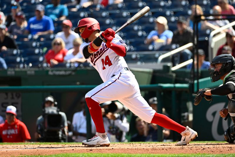 Sep 20, 2023; Washington, District of Columbia, USA; Washington Nationals third baseman Ildemaro Vargas (14) hits a RBI single against the Chicago White Sox during the second inning at Nationals Park. Mandatory Credit: Brad Mills-USA TODAY Sports