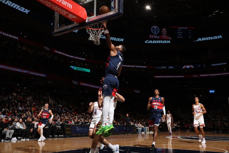 WASHINGTON, DC -?JANUARY 16 : Jared Butler #4 of the Washington Wizards dunks the ball during the game against the Phoenix Suns on January 16, 2025 at Capital One Arena in Washington, DC. NOTE TO USER: User expressly acknowledges and agrees that, by downloading and or using this Photograph, user is consenting to the terms and conditions of the Getty Images License Agreement. Mandatory Copyright Notice: Copyright 2024 NBAE (Photo by Stephen Gosling/NBAE via Getty Images)