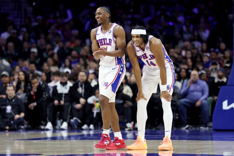 PHILADELPHIA, PENNSYLVANIA - FEBRUARY 02: Tyrese Maxey #0 of the Philadelphia 76ers talks to Ricky Council IV #14 during the first half against the Boston Celtics at the Wells Fargo Center on February 02, 2025 in Philadelphia, Pennsylvania. NOTE TO USER: User expressly acknowledges and agrees that, by downloading and or using this photograph, User is consenting to the terms and conditions of the Getty Images License Agreement. (Photo by Emilee Chinn/Getty Images)