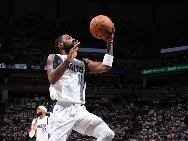 MINNEAPOLIS, MN - MAY 30: Kyrie Irving #11 of the Dallas Mavericks drives to the basket during the game against the Minnesota Timberwolves during Game 5 of the Western Conference Finals during the 2024 NBA Playoffs on May 30, 2024 at Target Center in Minneapolis, Minnesota. NOTE TO USER: User expressly acknowledges and agrees that, by downloading and or using this Photograph, user is consenting to the terms and conditions of the Getty Images License Agreement. Mandatory Copyright Notice: Copyright 2024 NBAE (Photo by David Sherman/NBAE via Getty Images)