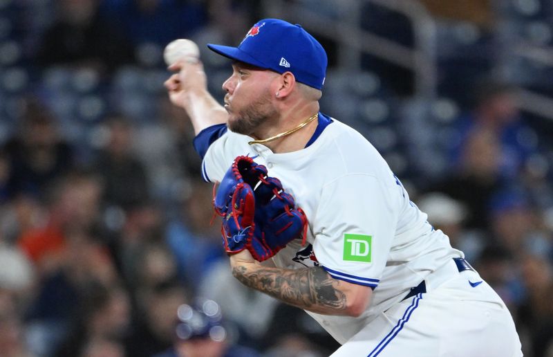 May 14, 2025; Toronto, Ontario, CAN;  Toronto Blue Jays relief pitcher Yariel Rodriguez (29) delivers a pitch against the Tampa Bay Rays in the eighth inning at Rogers Centre. Mandatory Credit: Dan Hamilton-Imagn Images