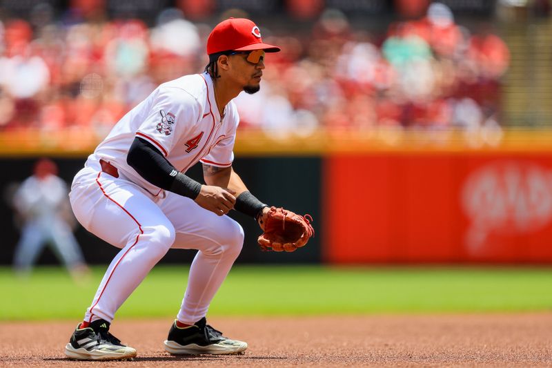 Jun 9, 2024; Cincinnati, Ohio, USA; Cincinnati Reds third baseman Santiago Espinal (4) prepares for the pitch in the first inning against the Chicago Cubs at Great American Ball Park. Mandatory Credit: Katie Stratman-USA TODAY Sports