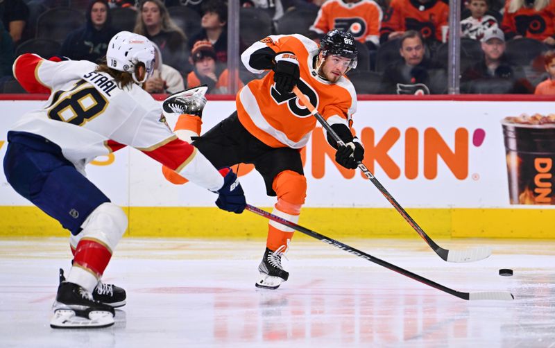 Mar 21, 2023; Philadelphia, Pennsylvania, USA; Philadelphia Flyers left wing Joel Farabee (86) shoots the puck against Florida Panthers defenseman Marc Staal (18) in the third period at Wells Fargo Center. Mandatory Credit: Kyle Ross-USA TODAY Sports