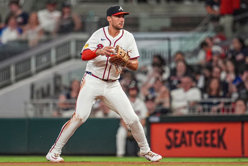 Jul 3, 2024; Cumberland, Georgia, USA; Atlanta Braves first baseman Matt Olson (28) fields a ball hit by San Francisco Giants pinch hitter Michael Conforto (8) (not pictured) during the eighth inning at Truist Park. Mandatory Credit: Dale Zanine-USA TODAY Sports